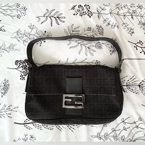 Fabulous FENDI Monogram Baguette Blk w/authentication card and dust bag.